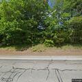 Female walking in and out of traffic on Douglas Pike