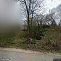 Leaning telephone pole reported on Hickory Lane
