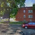 Two men looking into vehicles on West Altgeld