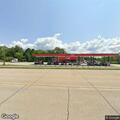 Trailer fire near store with car inside