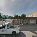 Dog locked in parked vehicle near cafe