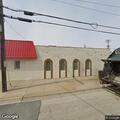 Person receiving CPR behind Lawrence Avenue restaurant