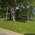 Tree branch on power line behind East Elm home