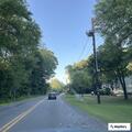 Driver slumped over wheel in white Ford sedan on Pond Street