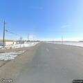 Man with breathing trouble and leg pain by highway