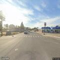 Car hits deer at intersection, deer in roadway