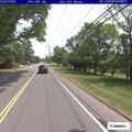 Erratic dark sedan reported on Shaker Road
