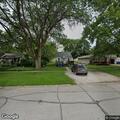 Officer serving warrant near South Cedar