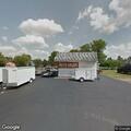 Officer checks on woman outside auto shop