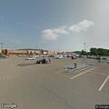 Person using loudspeaker near Walmart on bicycle