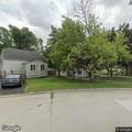 Officer serving subpoena at Church Street home