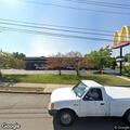 Officer checking vehicle near McDonald’s garage