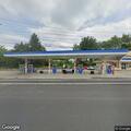 Rock thrown toward gas pumps at Mobil station
