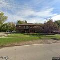 Person suffering abdominal pain at Lincoln Apartments