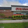 Two people acting suspiciously in pharmacy area