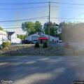Police search for suspect near sheds and wooded area