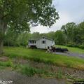 Driver found asleep in running car in driveway