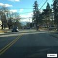 Officer checks vehicle in library parking lot
