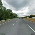 Person walking onto Massachusetts Turnpike on foot