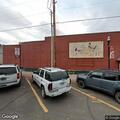 Male transient vomiting on bench at Lakeview Chamber of Commerce