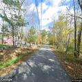 Tree creating road hazard on Bacon Hill Road
