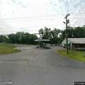 Low-hanging wires block roadway near filling station