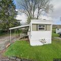 Man outside screaming for help at mobile home