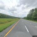 Disabled vehicle with open trunk on I-88 in Afton