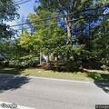 Large tree blocks road on Washington Street