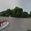 Person sitting and rocking by Speedway sign in Mattawan