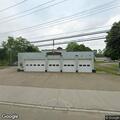 Female wandering in and out of traffic near fire hall