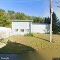 Person with cognitive issues and foot injury at garage
