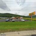 Car goes over guardrail near Dollar General