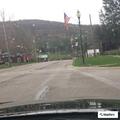 Truck loses tire and hits school crossing sign