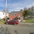 Woman with abdominal pain near Third Street in Athens
