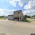 Person lying in front of laundromat reported