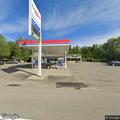 Motorist needs help with locked vehicle at gas station