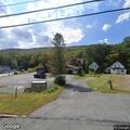 Male choking on pill at Chester Village Market