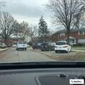 Man in hoodie checking car doors on Garling and Town