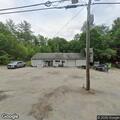 Disabled car with flat tire on Route 9