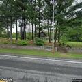 Driver hits property after distraction on Route 66