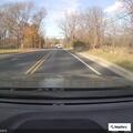 Wrong-way driver in gray vehicle near park toll booth