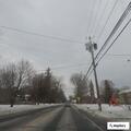 Debris in road after crash with utility pole