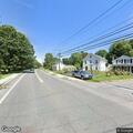 Man lying on road then walking on Chatham Street