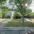 Neighbor reported hiding in bushes at home
