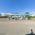 Woman causing disturbance at gas station entrance