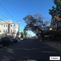 Woman yelling on balcony at Swan Street apartment