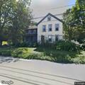 Man and woman arguing outside Hinsdale home