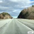 Car leaves road and enters woods on I-190 southbound