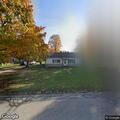 Man yelling and throwing items in backyard
